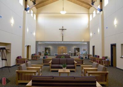 Interior seating room of St John the Apostle Catholic Church after Breiholz Construction restoration project